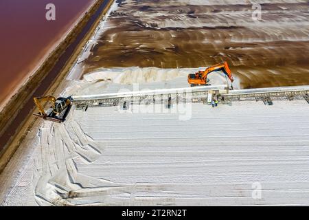 Huelva, Spain - October 21, 2023: Salt collection in the evaporators of sea salt in nature reserve Marismas del Odiel. Traditional Sea salt production Stock Photo