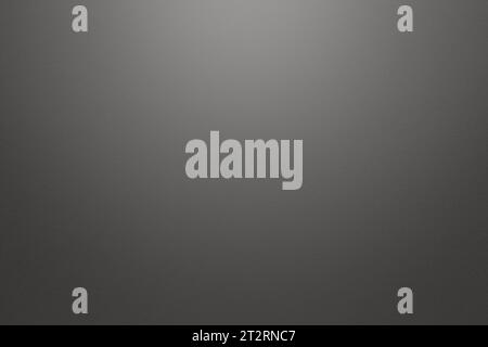 Light gray and grey textured paper background with light effect. High resolution full frame background with copy space in black and white. Stock Photo