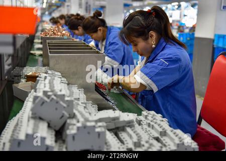 Fuyang, China. 18th Oct, 2023. Women wearing blue overalls work on the assembly line of a factory that produces electrical equipment. China's gross domestic product grew by 4.9 percent year-on-year in the third quarter after a 6.3 percent rise in the second quarter, posting a steady recovery despite downward pressures, the National Bureau of Statistics said on Wednesday. In the first three quarters, China's GDP grew by 5.2 percent to 91.3 trillion yuan ($12.5 trillion) after a 5.5 percent growth in the first half of the year, the bureau said. Credit: SOPA Images Limited/Alamy Live News Stock Photo