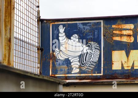 Ashikaga, Japan - April 18: Rusted Michelin advertising sign at an abandoned workshop. Michelin s a French multinational tyre manufacturing company, t Stock Photo