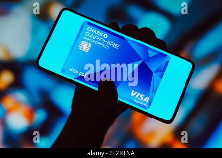A Louis Vuitton wallet standing on a wood surface with the Chase Sapphire  Preferred credit card sticking out of the pocket Stock Photo - Alamy