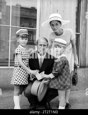 File photo dated 22-07-1969 of PA PHOTO 22/7/1969 Manchester United's Bobby Charlton shows the Insignia of his OBE with his wife Norma anbd daughters Suzanne (6) and Andrea (4) outside Buckingham Palace. Sir Bobby Charlton has died aged 86, his family have announced. Issue date: Saturday October 21, 2023. Stock Photo