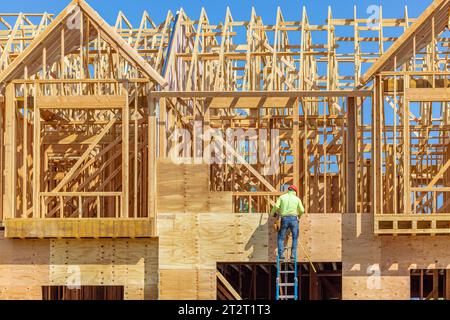 construction worker on a framing a house Stock Photo