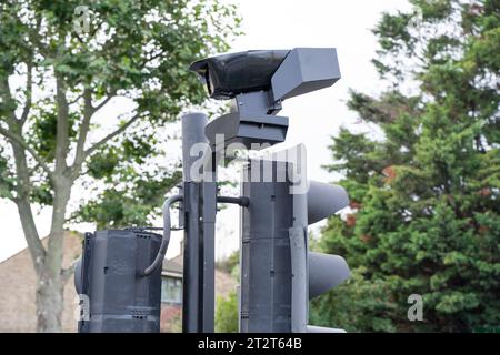 Greater London UK. 21st October 2023. ULEZ camera is installed onto the top of traffic lights post sharing electricity power. Credit: glosszoom/Alamy Live News Stock Photo