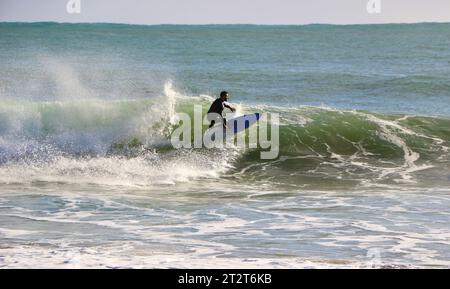 A surfer on a sunny October morning with 10 foot waves Sardinero ...