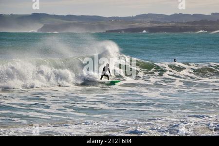 A surfer on a sunny October morning with 10 foot waves Sardinero ...