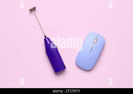 Computer mouse with mixer on pink background Stock Photo