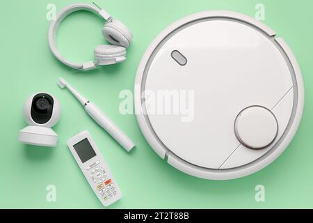 Modern gadgets on green background Stock Photo