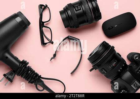 Modern gadgets on pink background Stock Photo