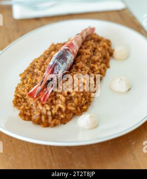 Gourmet rice dish with coastal shrimp Stock Photo