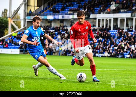 Peterborough, UK. 21st October 2023.Freddie Potts (19 Wycombe Wanderers) challenged by Hector Kyprianou (22 Peterborough United) during the Sky Bet League 1 match between Peterborough and Wycombe Wanderers at London Road, Peterborough on Saturday 21st October 2023. (Photo: Kevin Hodgson | MI News) Credit: MI News & Sport /Alamy Live News Stock Photo