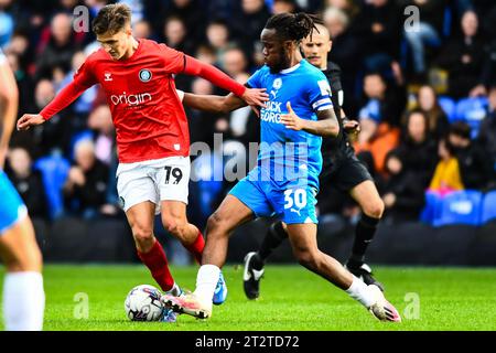 Peterborough, UK. 21st October 2023.Freddie Potts (19 Wycombe Wanderers) challenged by Peter Kioso (30 Peterborough United) during the Sky Bet League 1 match between Peterborough and Wycombe Wanderers at London Road, Peterborough on Saturday 21st October 2023. (Photo: Kevin Hodgson | MI News) Credit: MI News & Sport /Alamy Live News Stock Photo