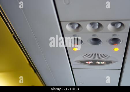 Close-up of Seat Belt Warning Light on Airplane Stock Photo