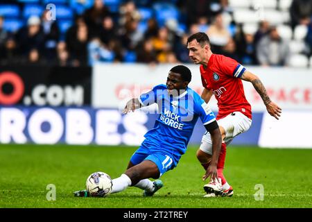 Peterborough, UK. 21st October 2023.Kwame Poku (11 Peterborough United) challenged by Josh Scowen (4 Wycombe Wanderers) during the Sky Bet League 1 match between Peterborough and Wycombe Wanderers at London Road, Peterborough on Saturday 21st October 2023. (Photo: Kevin Hodgson | MI News) Credit: MI News & Sport /Alamy Live News Stock Photo