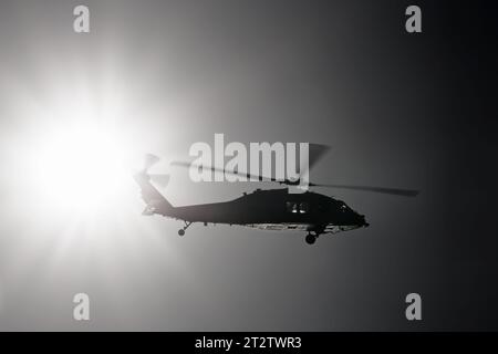 A US Navy UH-60 Black Hawk helicopter over Coronado, California. Stock Photo