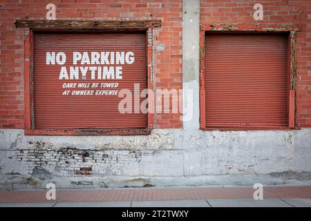 Two roll up loading doors on the side of an old building near the downtown district at the downtown area of El Paso, Texas. Stock Photo