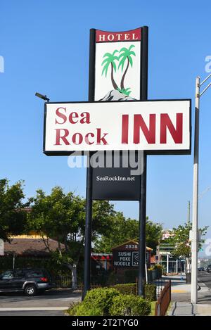 LONG BEACH, CALIFORNIA - 18 OCT 2023: Closeup of the Sea Rock Inn hotel sign on Pacific Coast Highway, PCH. Stock Photo