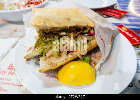 Istanbul, Turkey, Balık ekmek is a popular street food in Turkish cuisine. It is a sandwich of a filet of fried or grilled fish (typically mackerel). Stock Photo