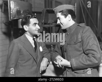 IRVING BERLIN talking to leading man TYRONE POWER on the set of ALEXANDER'S RAGTIME BAND 1938 Direector HENRY KING Costume Design GWEN WAKELING Music and Lyrics by IRVING BERLIN 20th Century Fox Stock Photo
