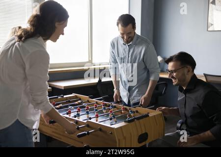 Happy joyful teammates, friendly colleagues having fun in office Stock Photo