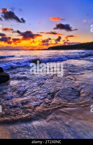 Pacific ocean seascape sunrise over Middle Camp beach at Catherine Hill bay in Australia. Stock Photo
