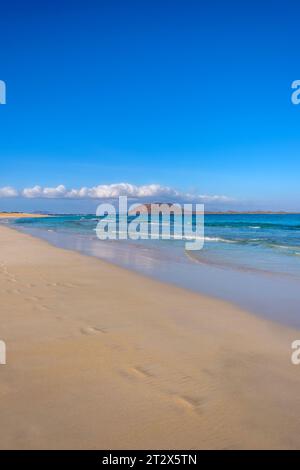 View on Corralejo beach and Lobos island, blue water and golden sand and the Canary Island Fuerteventura, Spain. Stock Photo