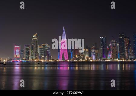 The West Bay city skyline at night in Doha, Qatar. Stock Photo