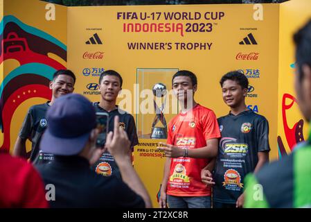 FIFA U-17 WOLRD CUP 2023 TROPHY EXPERIENCE People take pictures with the U-17 Football World Cup trophy during the FIFA U-17 World Cup 2023 Trophy Experience in Bandung, West Java, Indonesia, October 22, 2023. The event was held to welcome the U-17 World Cup Football to be held in Indonesia on 10 November, 2023. Credit: Imago/Alamy Live News Stock Photo