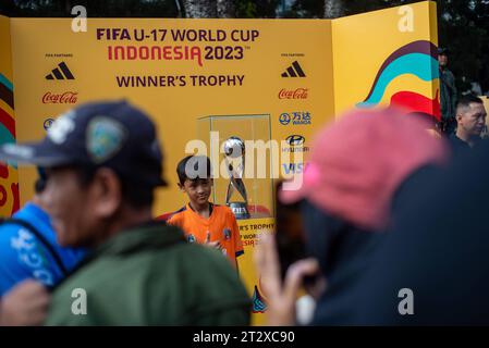 FIFA U-17 WOLRD CUP 2023 TROPHY EXPERIENCE People take pictures with the U-17 Football World Cup trophy during the FIFA U-17 World Cup 2023 Trophy Experience in Bandung, West Java, Indonesia, October 22, 2023. The event was held to welcome the U-17 World Cup Football to be held in Indonesia on 10 November, 2023. Credit: Imago/Alamy Live News Stock Photo