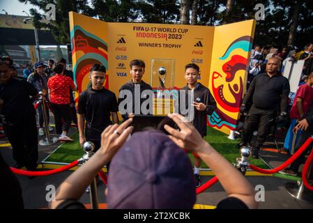 FIFA U-17 WOLRD CUP 2023 TROPHY EXPERIENCE People take pictures with the U-17 Football World Cup trophy during the FIFA U-17 World Cup 2023 Trophy Experience in Bandung, West Java, Indonesia, October 22, 2023. The event was held to welcome the U-17 World Cup Football to be held in Indonesia on 10 November, 2023. Credit: Imago/Alamy Live News Stock Photo