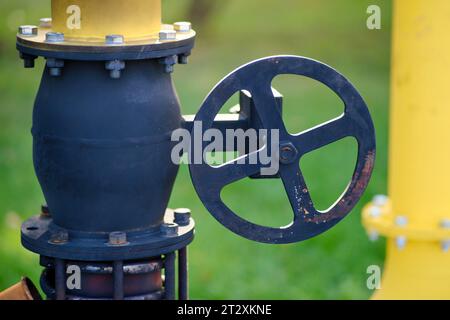 Fire extinguishing module with heat flow on gas pipes. Close up of oil and gas pipelines and valves on green grass background Stock Photo
