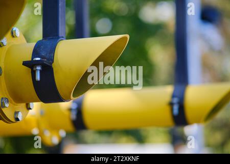 Fire extinguishing module with heat flow on gas pipes. Big yellow gas pipeline in the park, close-up of the pipe Stock Photo