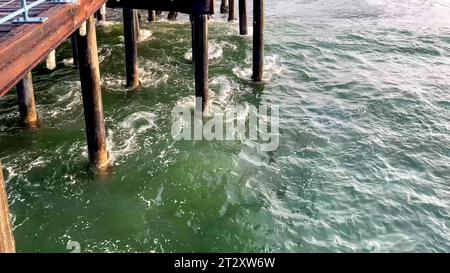 Wooden pillars of the Santa Monica Pier, well known in Los Angeles, in the state of California, in the United States of America as it is the setting f Stock Photo
