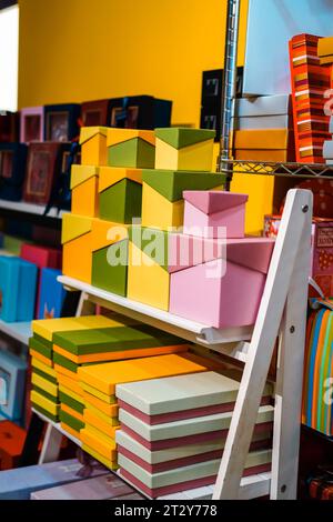 Gift box variety: vibrant colors and patterns neatly organized on tiered racks Stock Photo
