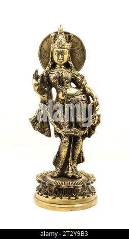 an indian bronze sculpture of indian queen radha with detailed decoration, front view isolated in a white background Stock Photo