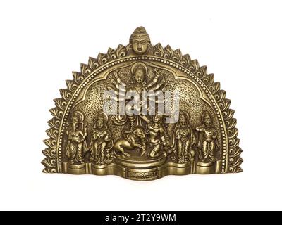 brass handicraft statue of goddess durga of hindu religion slaying demon mahishasura, used during durga pooja festival isolated Stock Photo