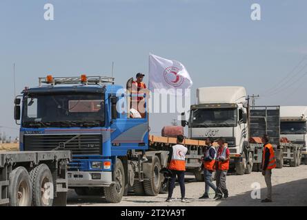 Gaza, Palestine. 21st Oct, 2023. Employees from the Palestinian Red Crescent Society hang a flag on a truck, at Rafah border. United Nations (UN) agency is expected to deliver humanitarian aid to those in need in various areas of the Gaza Strip, Gaza government media office said on Saturday. Credit: SOPA Images Limited/Alamy Live News Stock Photo