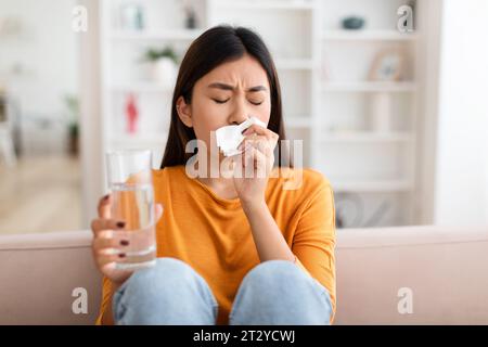 Pregnant young asian woman having nausea and feeling ill Stock Photo