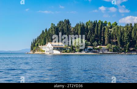 The little fishing harbour of Kouloura on the north-east coast of Corfu in the Ionian Islands of Greece Stock Photo