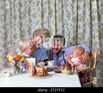 Family indoors having breakfast. Stock Photo