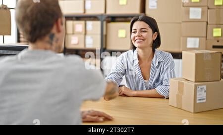 Two ecommerce business worker and client shaking hand at office Stock Photo