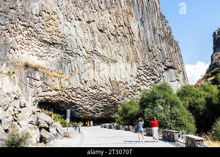 Garni, Armenia - September 30, 2023: people walk in symphony of the stones place in Garni gorge in Armenia on sunny autumn day Stock Photo