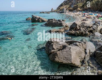 09-22-2023. Italy; The famous Michelino Beach, near Tropea, in September with crowd of tourist, bathers and umbrella. Parghelia, Vibo Valentia, Calabr Stock Photo