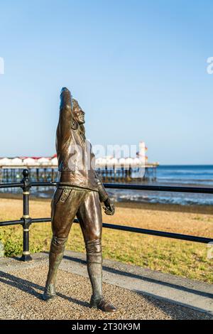 Statue of the famous 1930's flying legend Amy Johnson created by artist Stephen Melton on Herne Bay seafront. Smiling as she looks up at the sky. Stock Photo