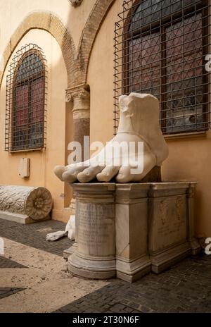 Rome, Italy - April 11, 2023: The left foot of the Colossus of Constantine in the courtyard of the Palazzo dei Conservatori in Rome, Italy Stock Photo