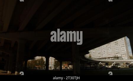 The road removed from the car. Stock footage. Streetscape with a large bridge and parks with large high-rise buildings. Stock Photo