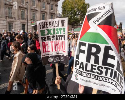 Pro-Palestinian marchers  in London, UK, at the National March for Palestine  demonstration Stop the war on Gaza, march to protest about the Israel Palestine confict over the Gaza Strip, protesters marching to Downing street  with Free Palestine posters. Stock Photo