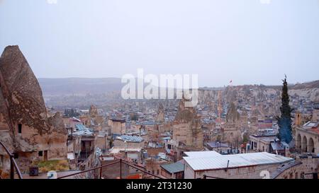 Aerial view of a summer southern city on a cloudy sky background. Action. Many roofs of buildings. Stock Photo