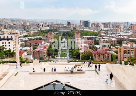 Yerevan, Armenia - September 29, 2023: above view of Cascade complex and green Tamanyan street and Yerevan opera house in Yerevan city in autumn twili Stock Photo