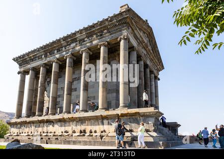 Garni, Armenia - September 30, 2023: visitors near ancient Greco-Roman Temple of Garni in Armenia on autumn day. It is the only monument surviving in Stock Photo